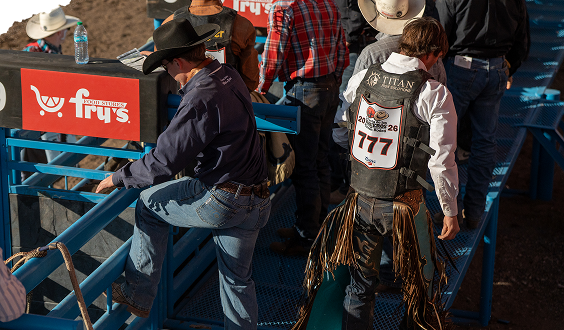 Rodeo competitors behind the chutes