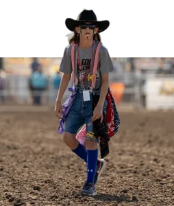 A young Steer Riding competitor walking through the arena